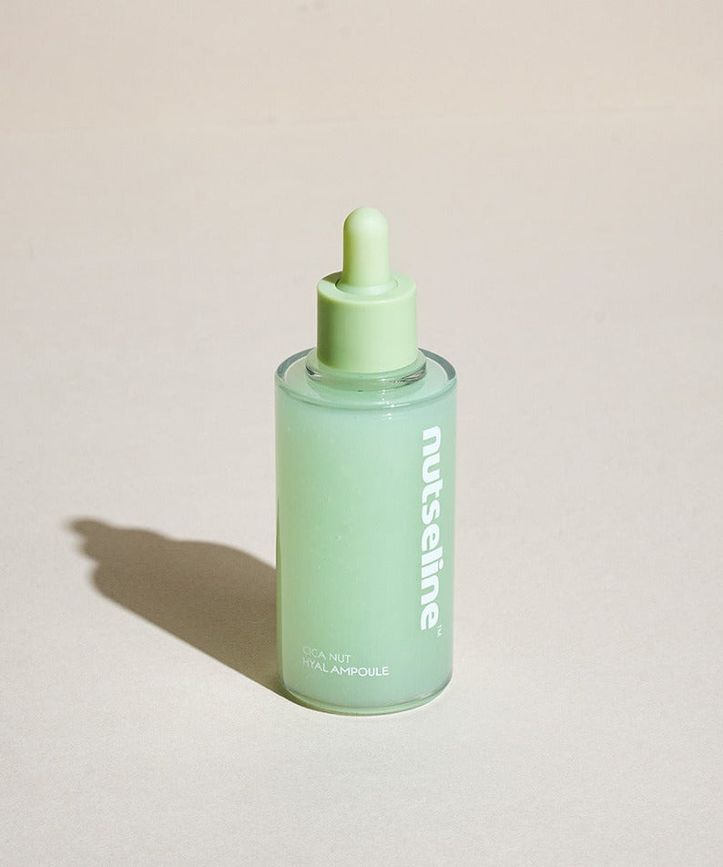 NUTSELINE Cica Nut Hyal Ampoule 90ml green bottle on a neutral background