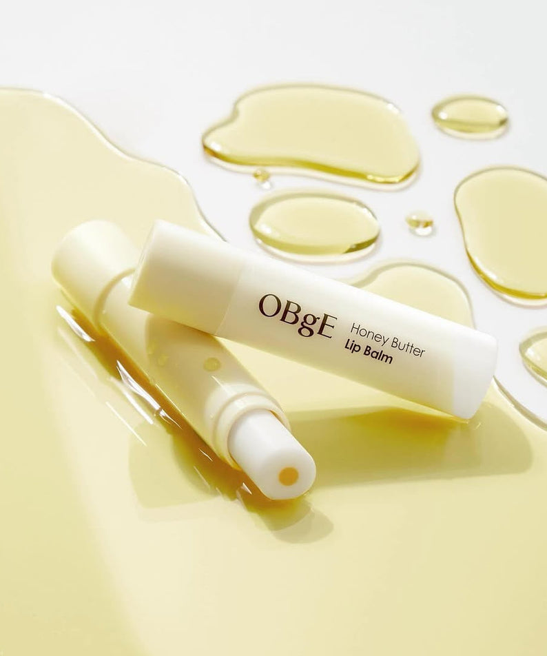 OBGE Honey Butter Lip Balm on glossy honey background – Gentleman Korea Korean skincare for men