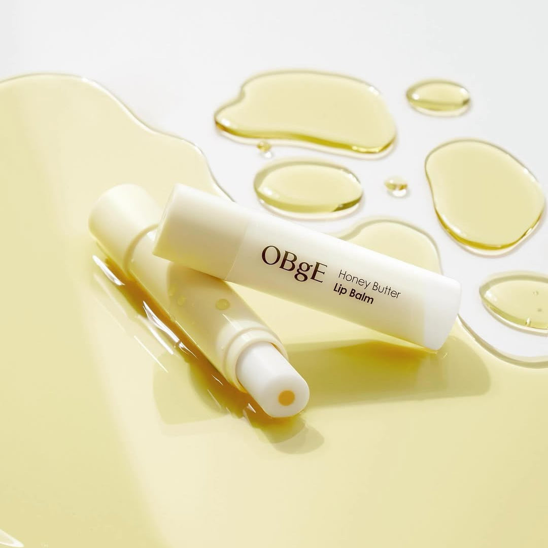 OBGE Honey Butter Lip Balm on glossy honey background – Gentleman Korea Korean skincare for men