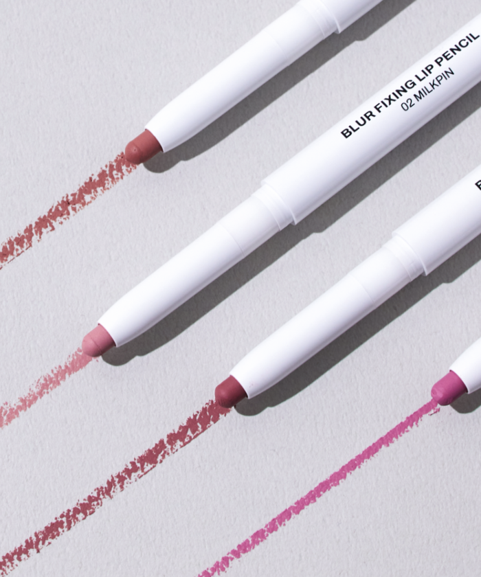 OIAD Blur Fixing Lip Pencil displayed in various shades on a neutral background