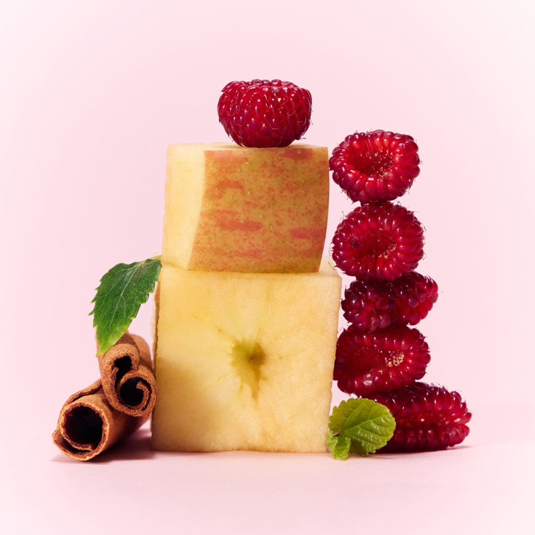 Fresh raspberries and apple with cinnamon, ingredients in OSULLOC Berry Garden Green Tea 10 P on a pastel background.