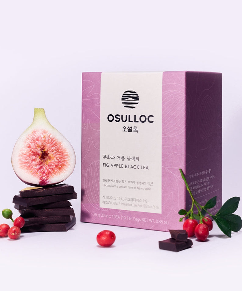 OSULLOC Fig Apple Black Tea 10 P with fig, apple, and tea packaging next to fresh fruit and chocolate pieces.