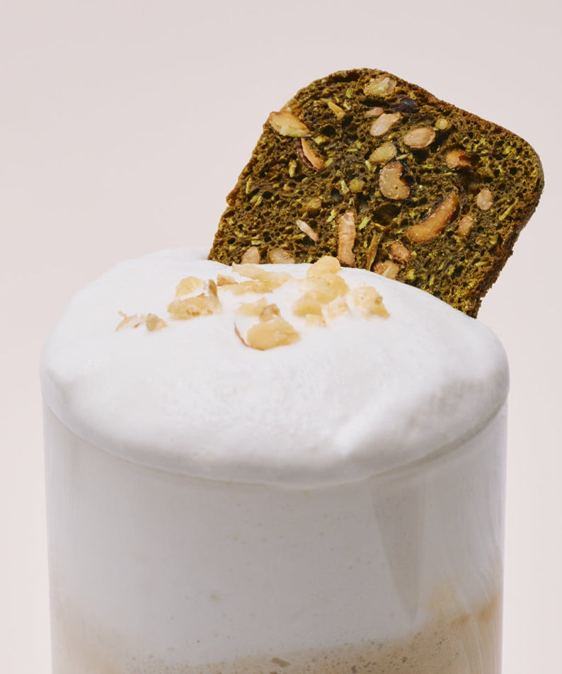 OSULLOC Matcha Biscotti Chips 100g garnishing a creamy beverage topped with nuts