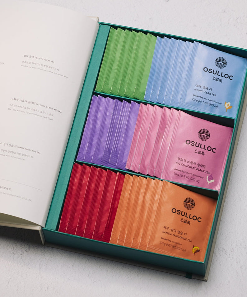 OSULLOC Tea Variation O 6 types in a gift box with colorful tea sachets displayed elegantly on a table.