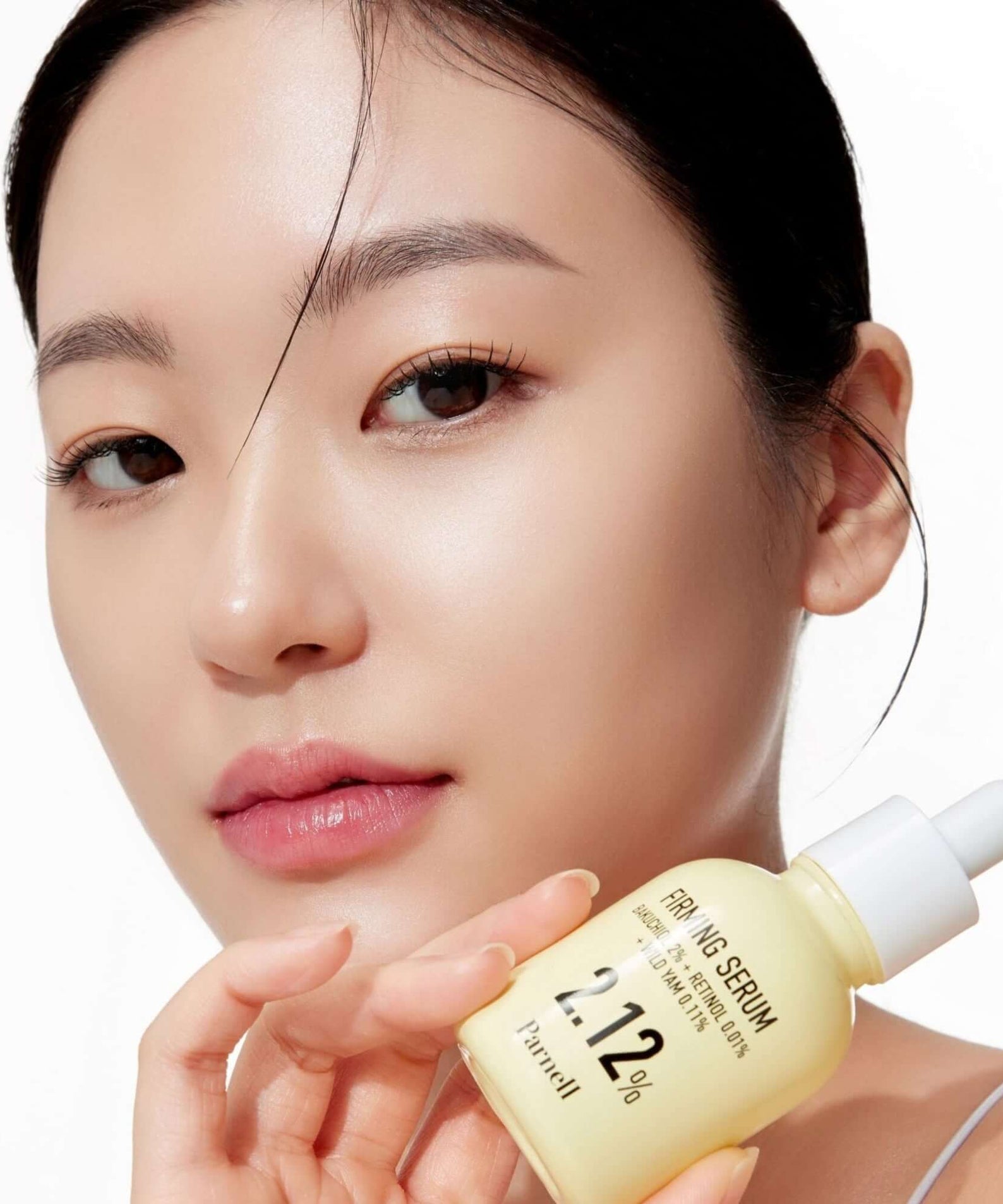 PARNELL Bakuchiol Wild Yam 2.12 Firming Serum 30ml shown with model for skincare routine