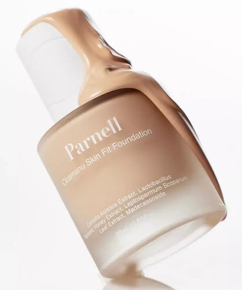 PARNELL Cicamanu Skin Fit Foundation 30g bottle with foundation texture flowing over the edge, showcasing its creamy consistency.