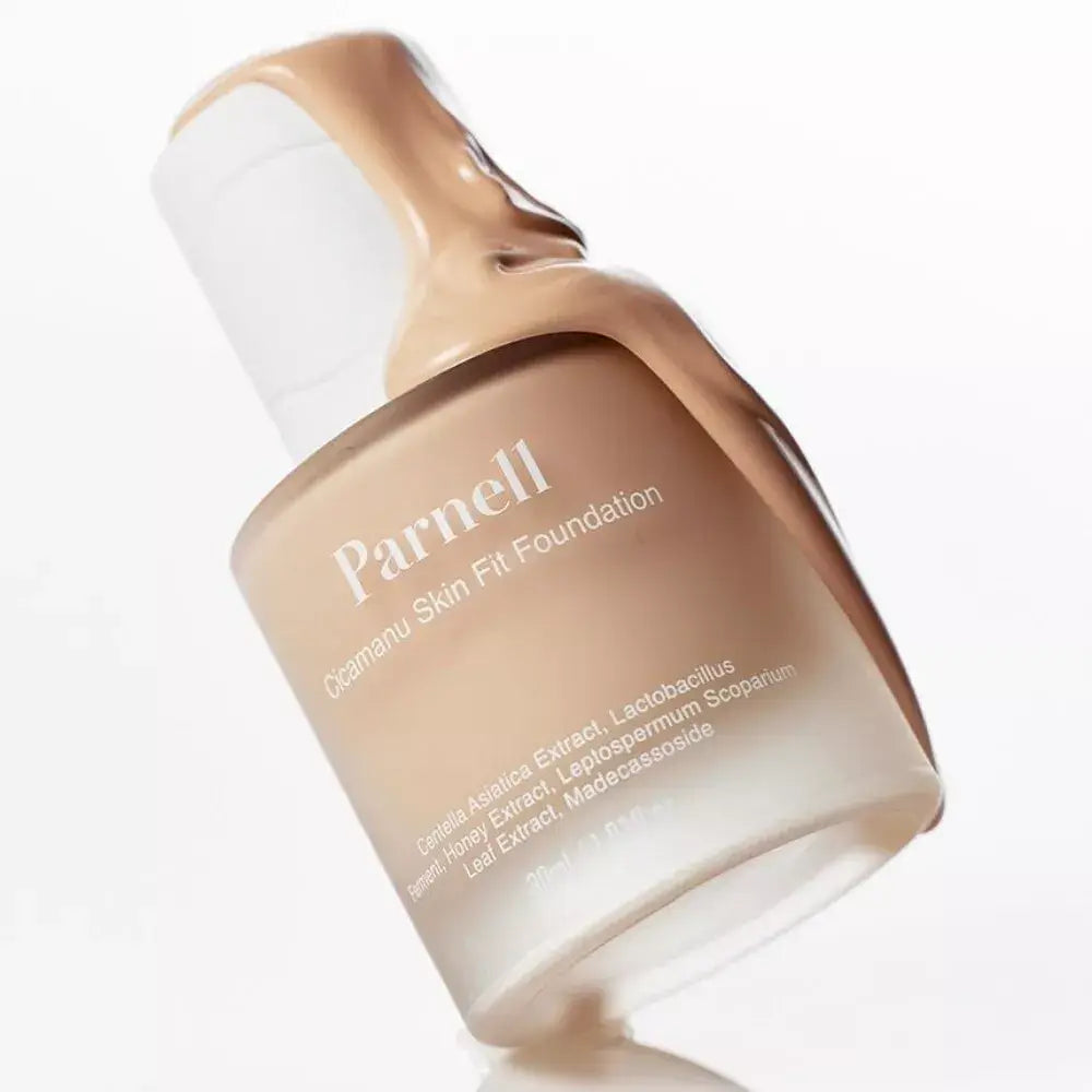 PARNELL Cicamanu Skin Fit Foundation 30g bottle with foundation texture flowing over the edge, showcasing its creamy consistency.