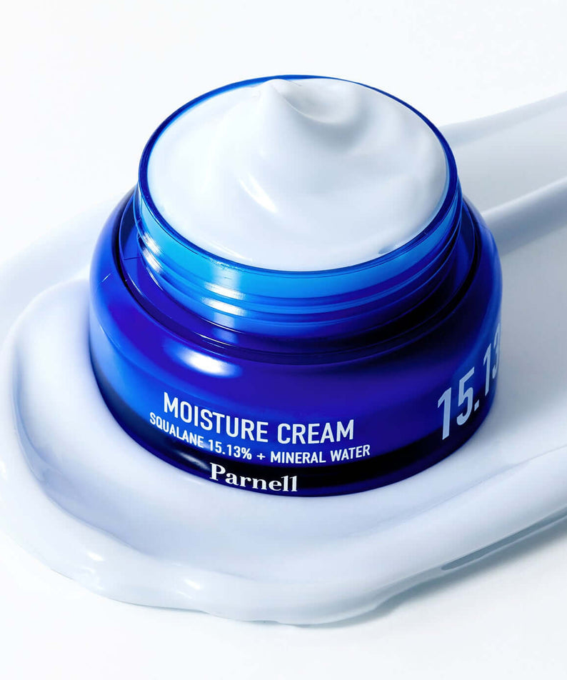 PARNELL Squalane 15.13 Mineral Water Moisture Cream 50ml in open blue jar with cream texture on white background.