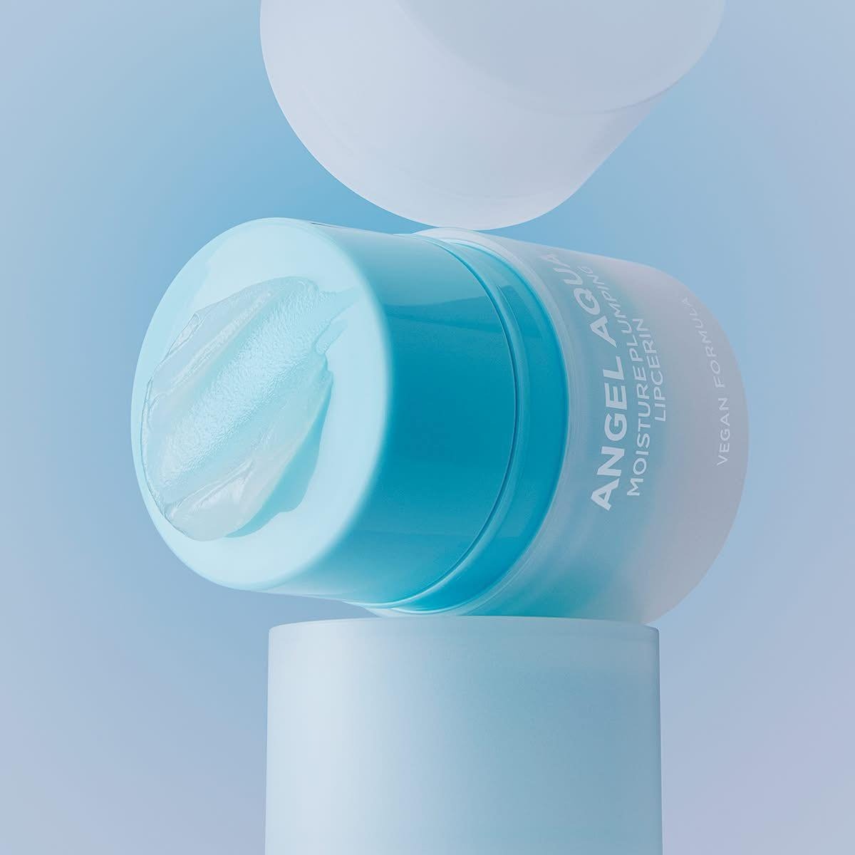 PASSION&BEYOND Angel Aqua Moisture Plumping Lipcarin 15ml product packaging on display with blue background.
