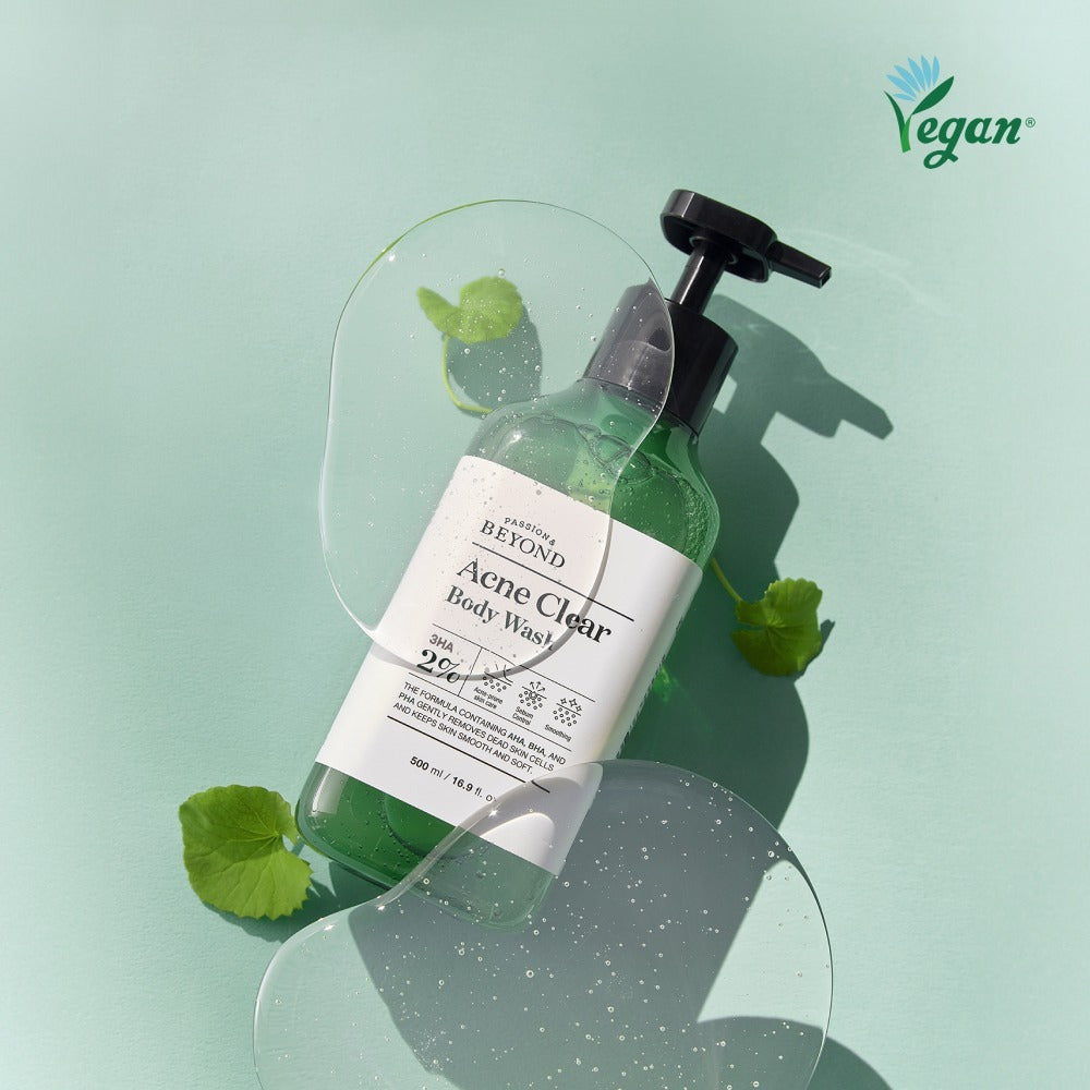 PASSON&BEYOND Acne Clear Body Wash 500ml bottle with green leaves and clear gel overlay, vegan product on mint background.