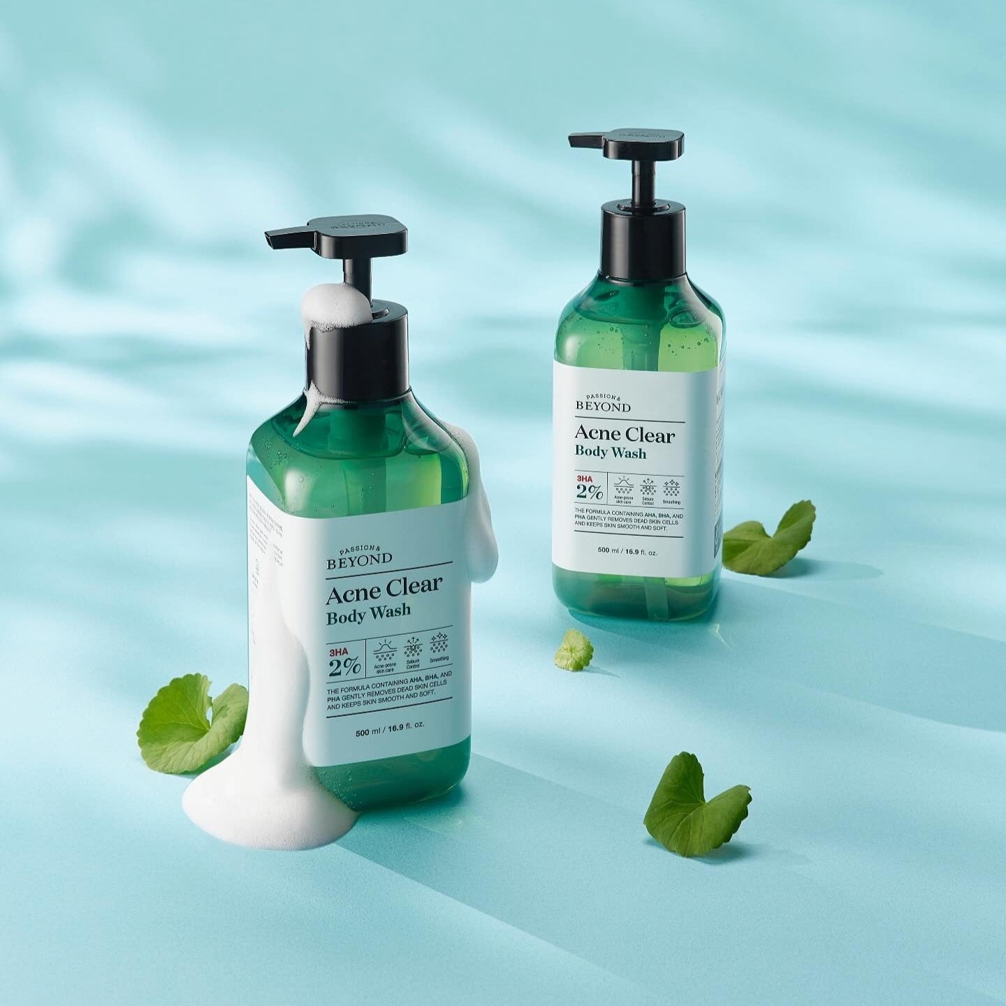 PASSON&BEYOND Acne Clear Body Wash 500ml bottles on light blue background with green leaves.