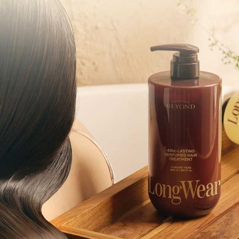 PASSON&BEYOND LongWear 48hr Lasting Perfumed Hair Treatment 950ml bottle next to silky hair in a serene bathroom setting.
