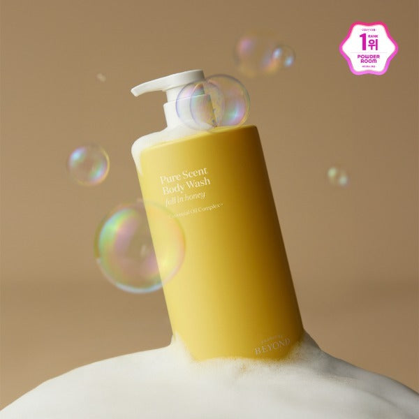Yellow bottle of PASSON&BEYOND Pure Scent Full-in-Honey Boday Wash 700g with bubbles on a frothy background.
