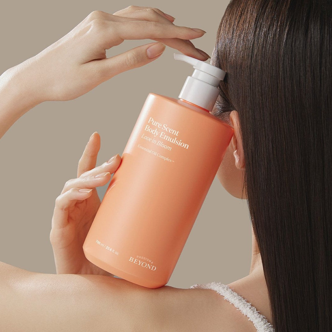 Person holding a bottle of PASSON&BEYOND Pure Scet Love in Bloom Body Wash 700g.