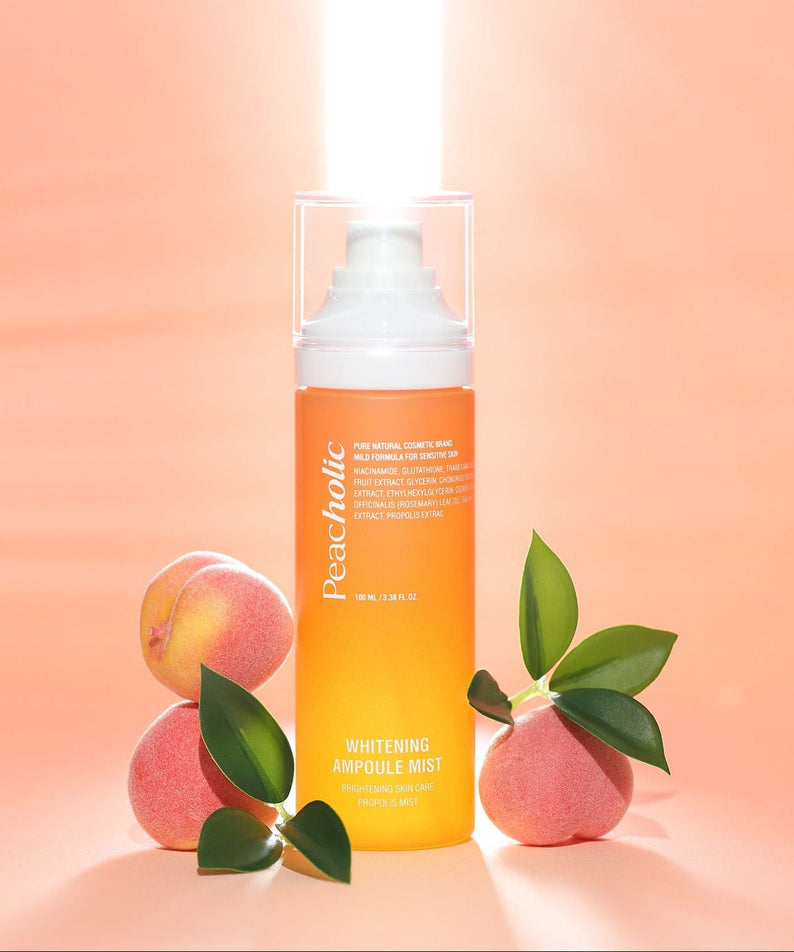 PEACHOLIC Whitening Ampoule Mist 100ml bottle with peaches on a peach-colored background