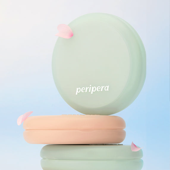 PERIPERA Filter Fit Milk Tone-Up Cushion with pastel packaging and floral accents on a light background