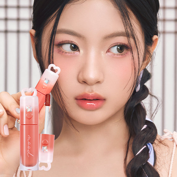 PERIPERA Ink Mood Glowy Tint Princess Hours Collection displayed by a model with glowing skin and subtle lip tint in a soft setting.