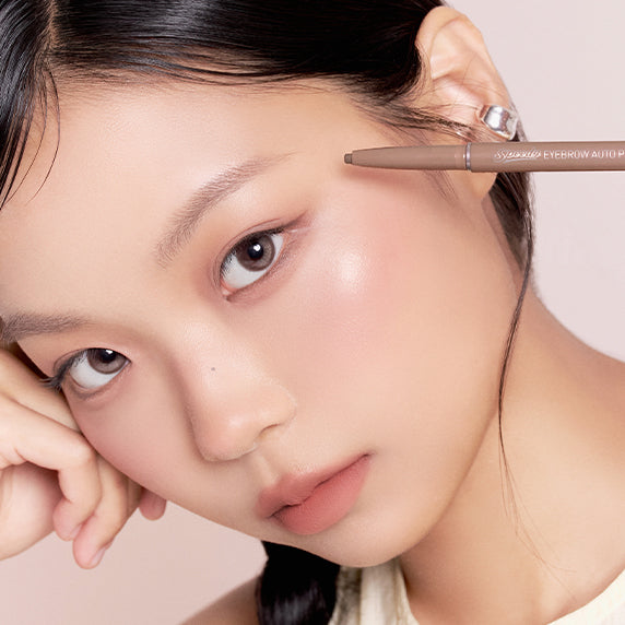 Model using PERIPERA NEW Speedy Eyebrow Auto Pencil 25AD for precise eyebrow shaping
