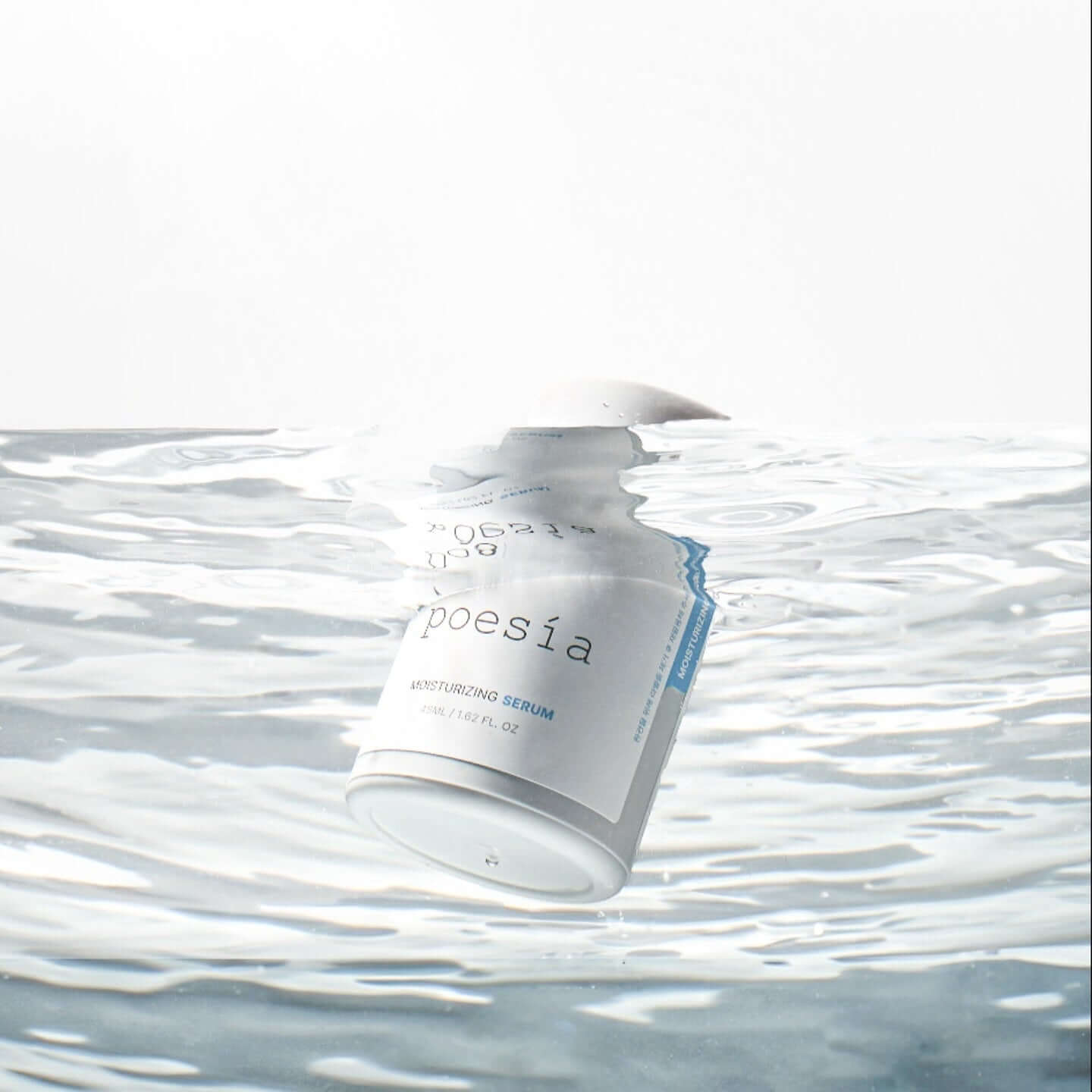 POESÃA Hydro Hyaluronic Deep Moisturizing Ampoule Serum 48ml floating in water