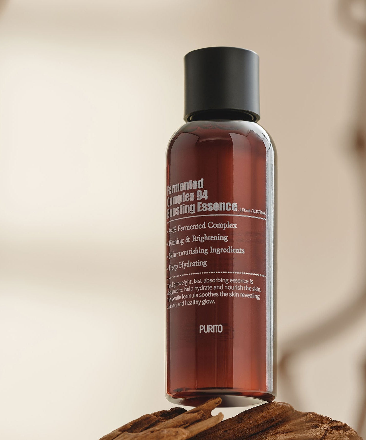 PURITO Fermentedd Complex 94 Boosting Essence 150ml bottle on wooden surface