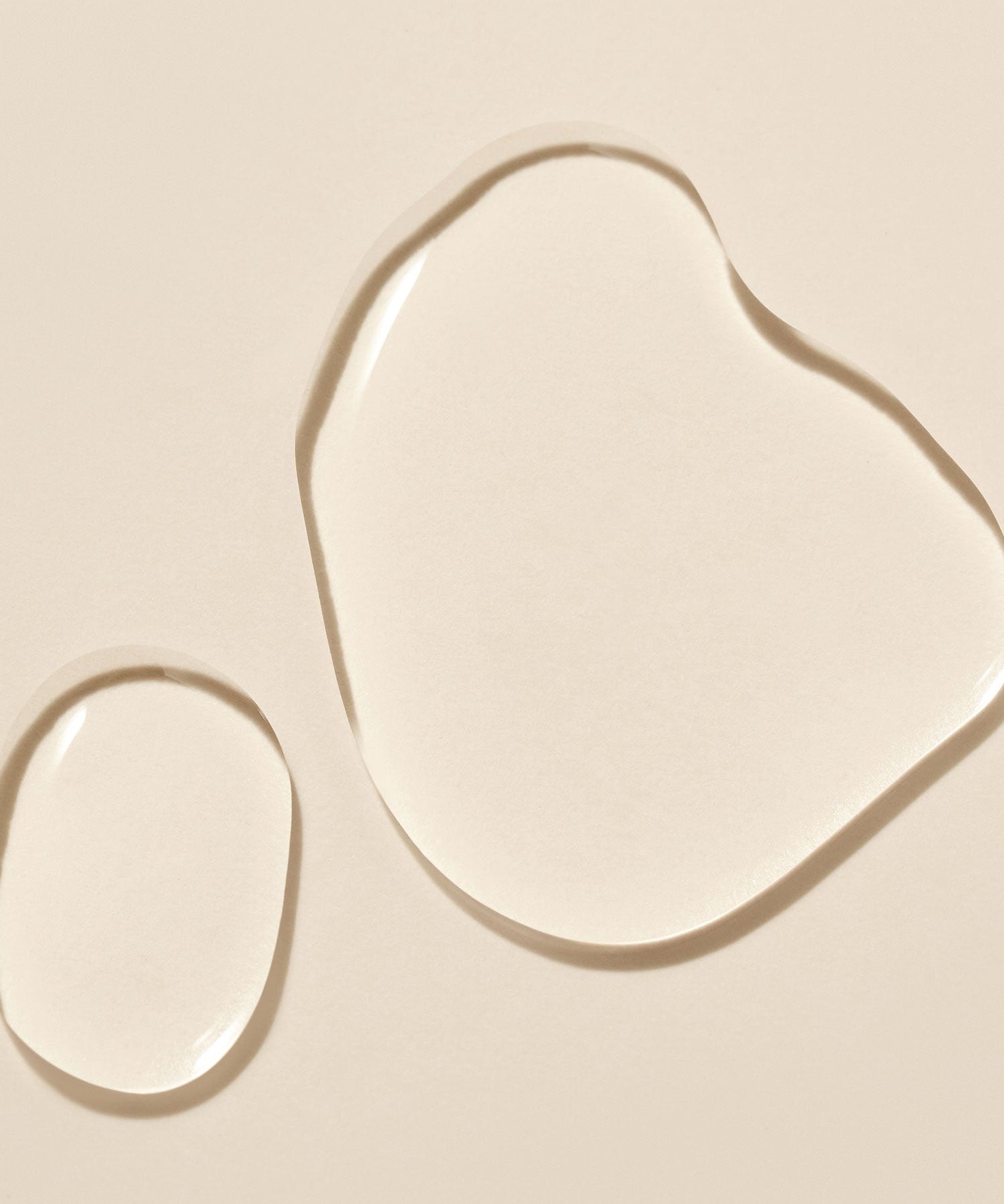 Texture of PURITO Fermentedd Complex 94 Boosting Essence 150ml displayed on a beige background