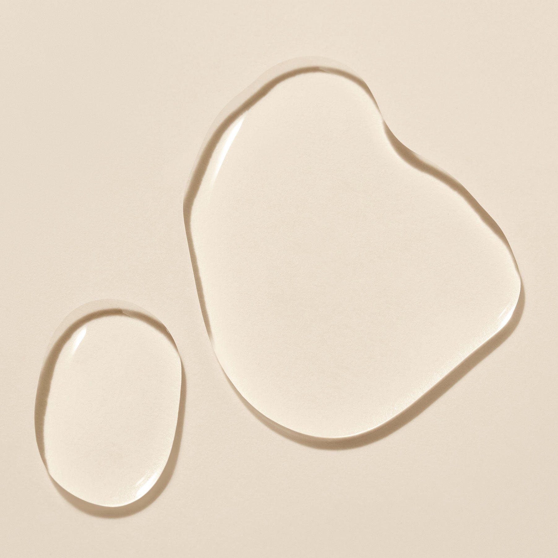 Texture of PURITO Fermentedd Complex 94 Boosting Essence 150ml displayed on a beige background