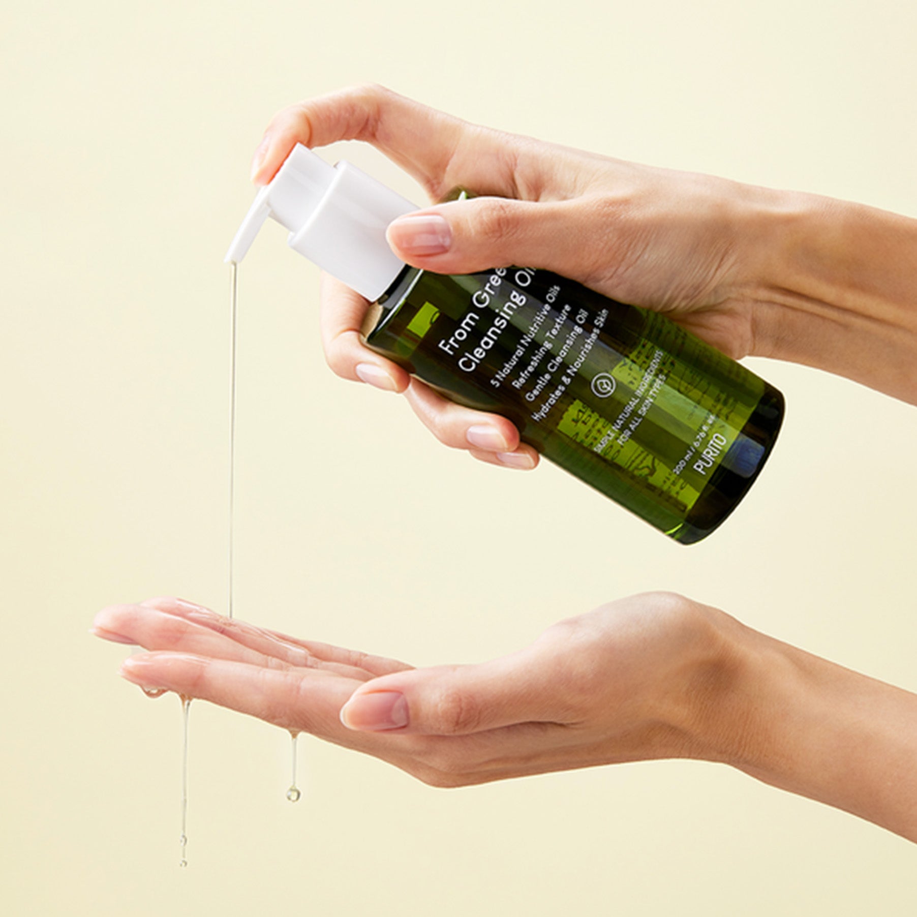PURITO From Green Cleansing Oil 200ml being applied from a pump bottle