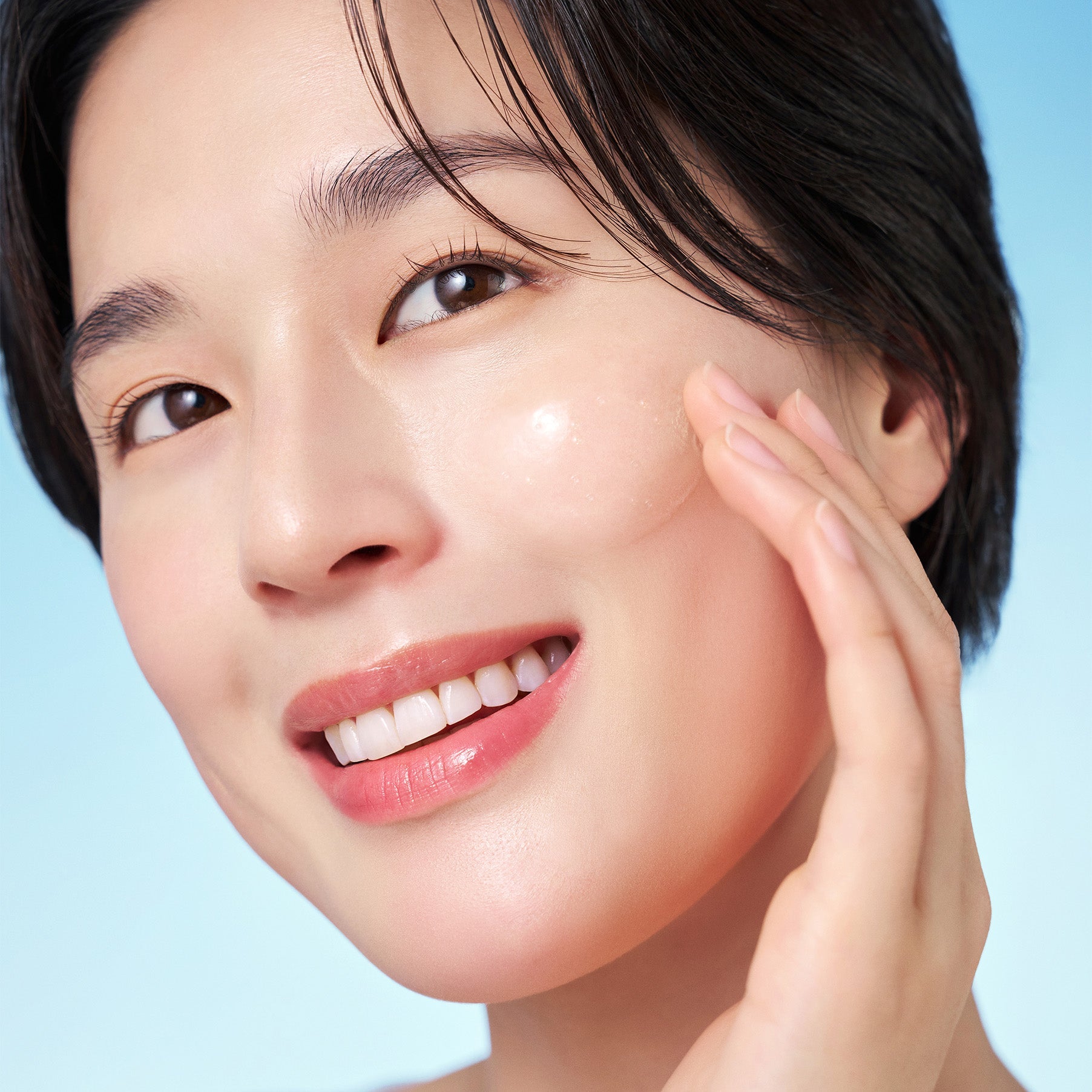 Person applying PURITO Hydro Wave Deep Sea Serum 60ml to smooth skin.