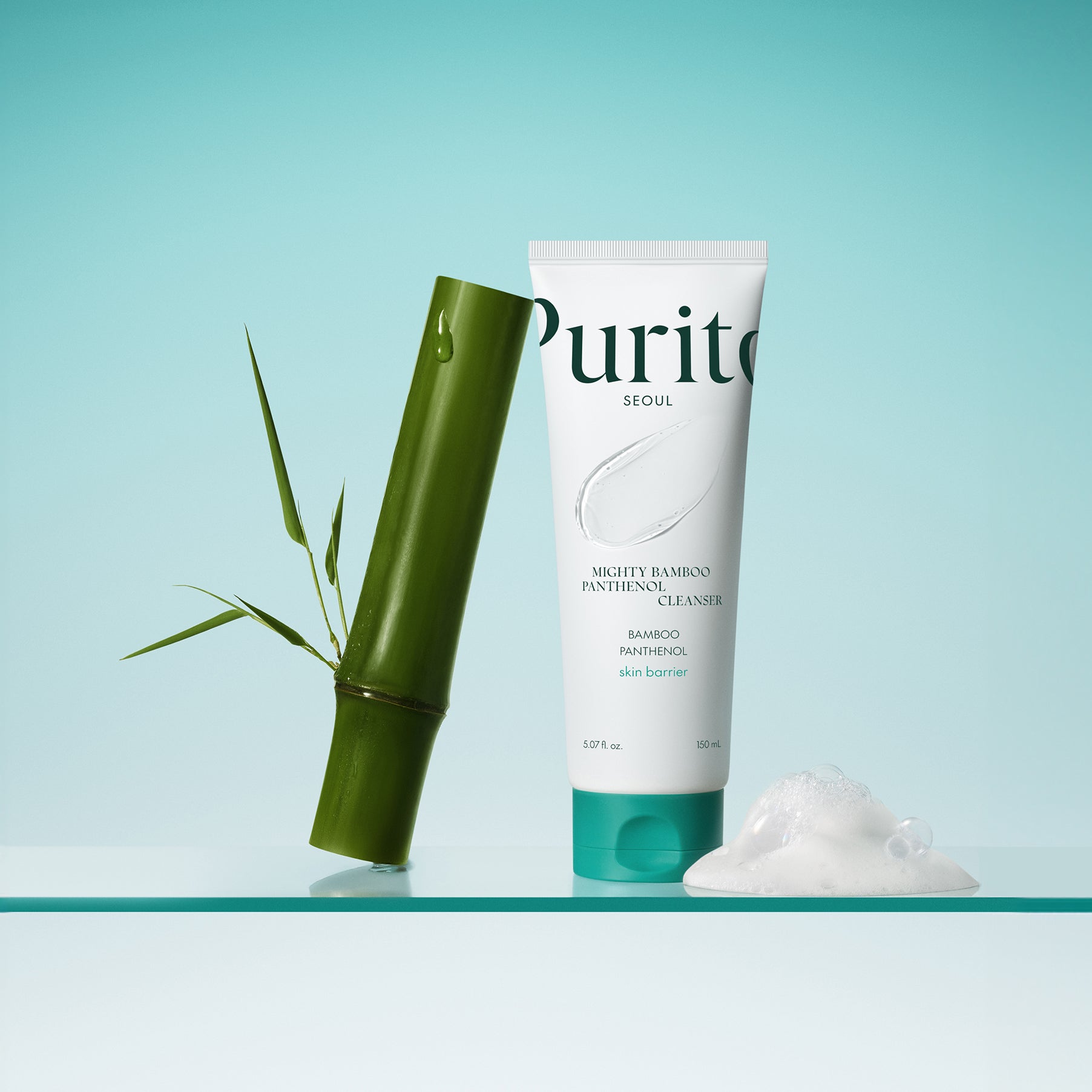 PURITO Mighty Bamboo Panthenol Cleanser 150ml with bamboo and foam on a reflective surface.