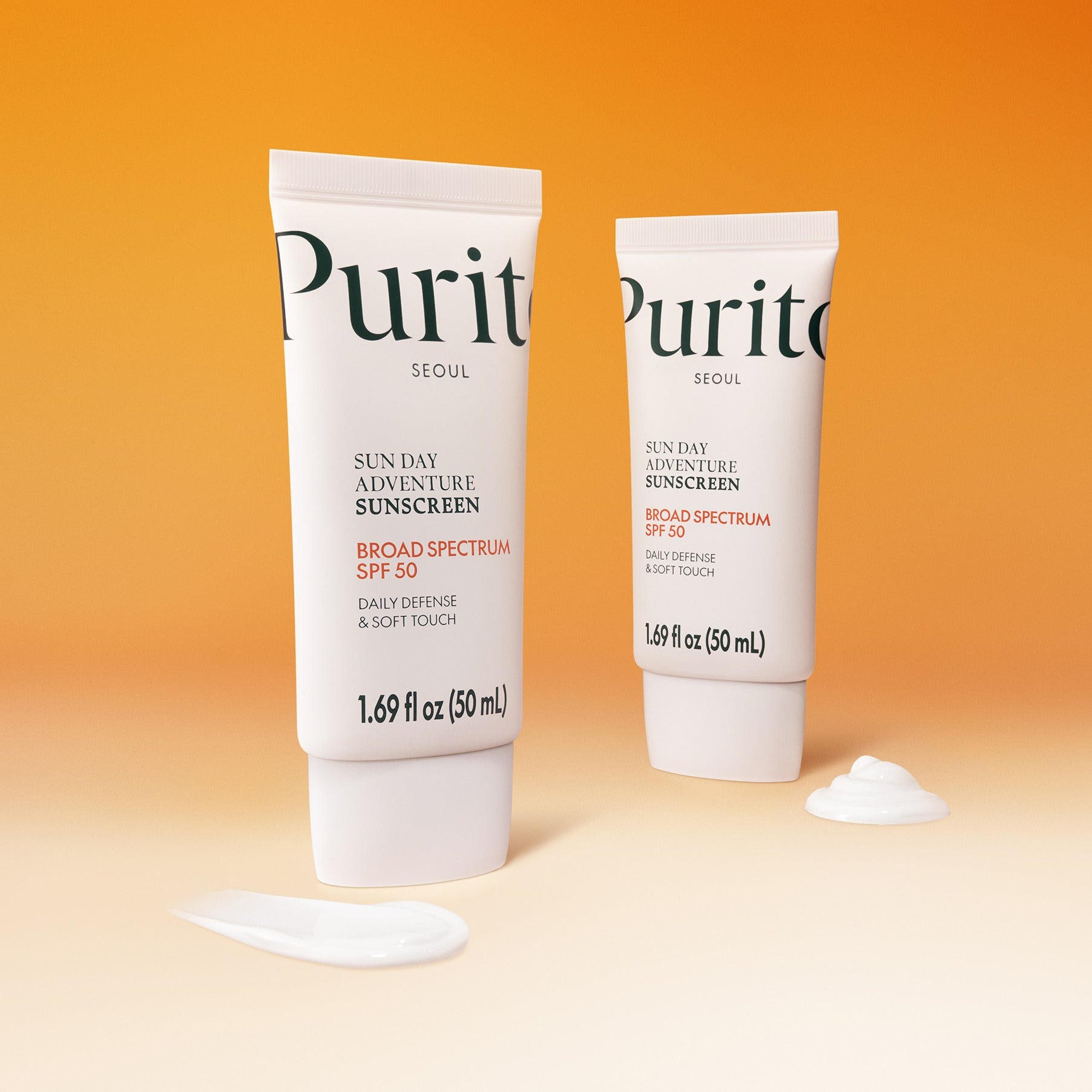PURITO Sunday Adventure Sunscreen SPF50 50ml tubes on an orange background