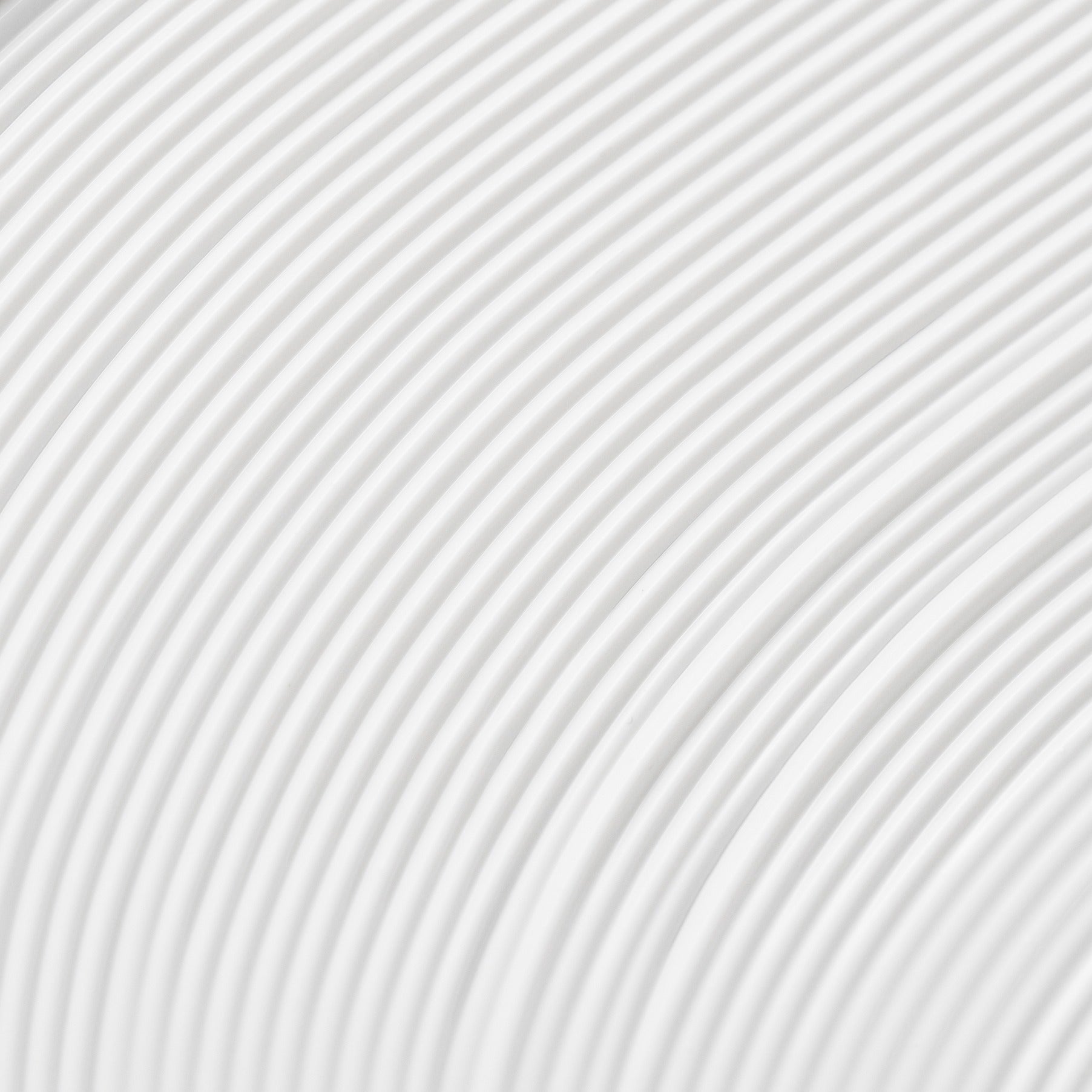 Abstract image of curved white lines forming a pattern on a light background.