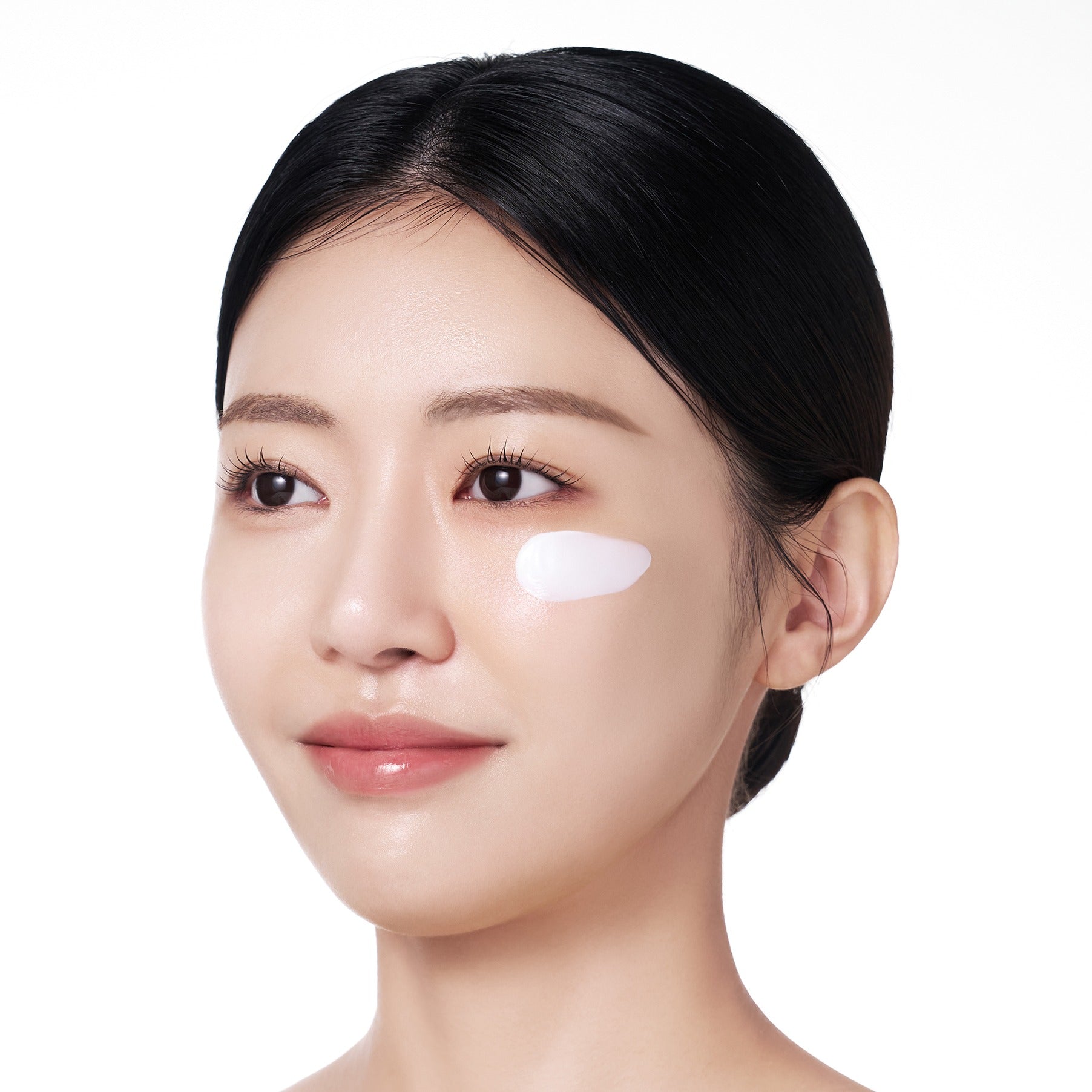 Person applying PURITO Sunday Adventure Sunscreen SPF50 50ml on face for protection and skincare
