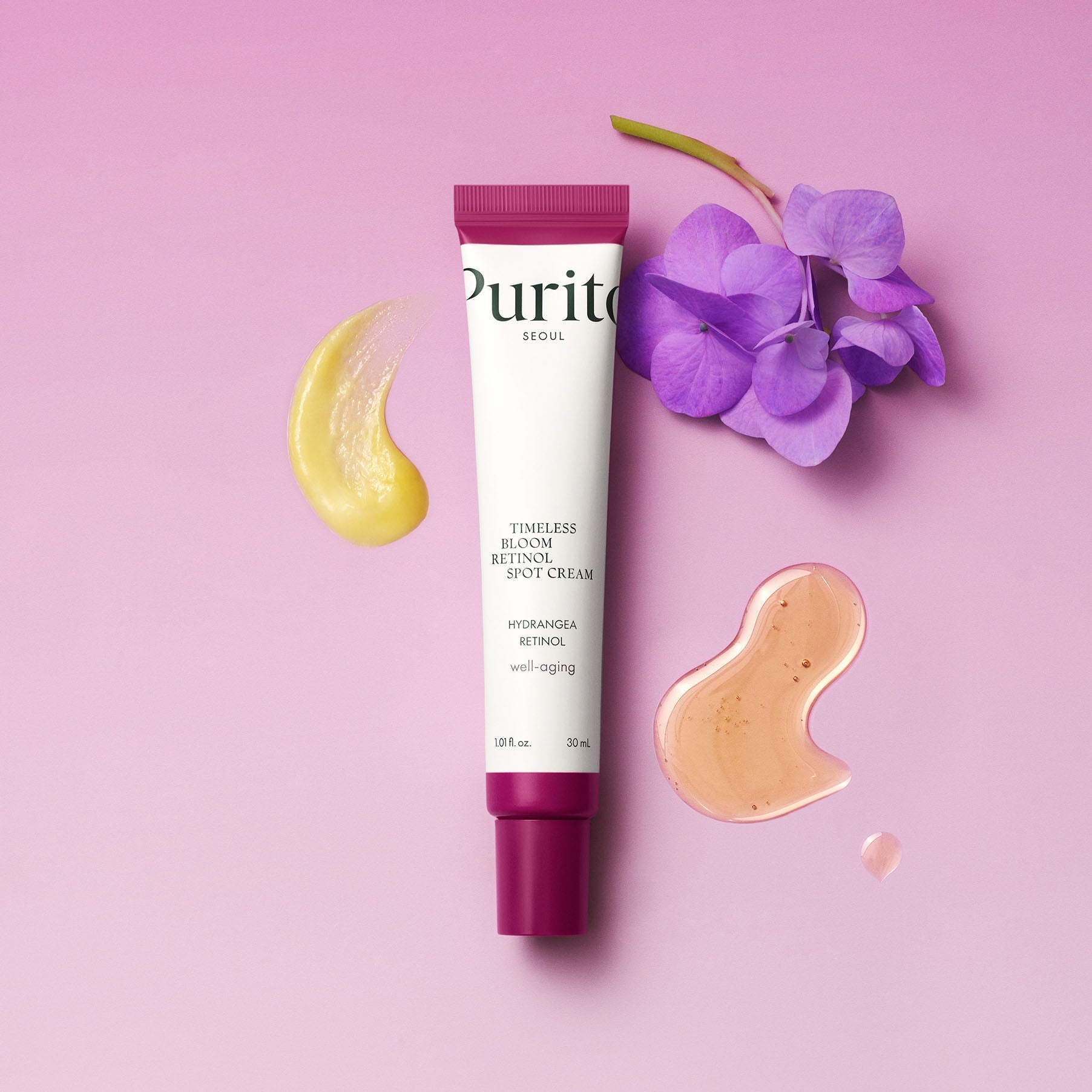 PURITO Timeless Bloom Retinol Spot Cream 30ml with floral and cream swatch accents on pink background