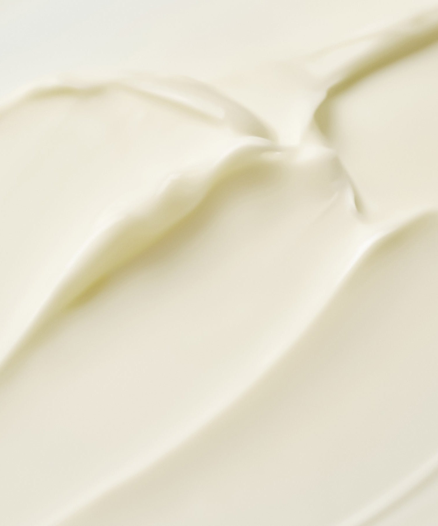 Texture of PURITO Timeless Bloom Retinol Spot Cream 30ml cream swatch, showing smooth and creamy application.