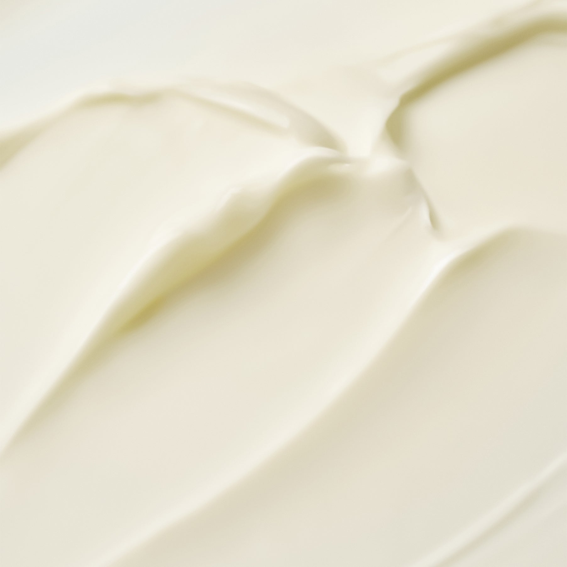 Texture of PURITO Timeless Bloom Retinol Spot Cream 30ml cream swatch, showing smooth and creamy application.