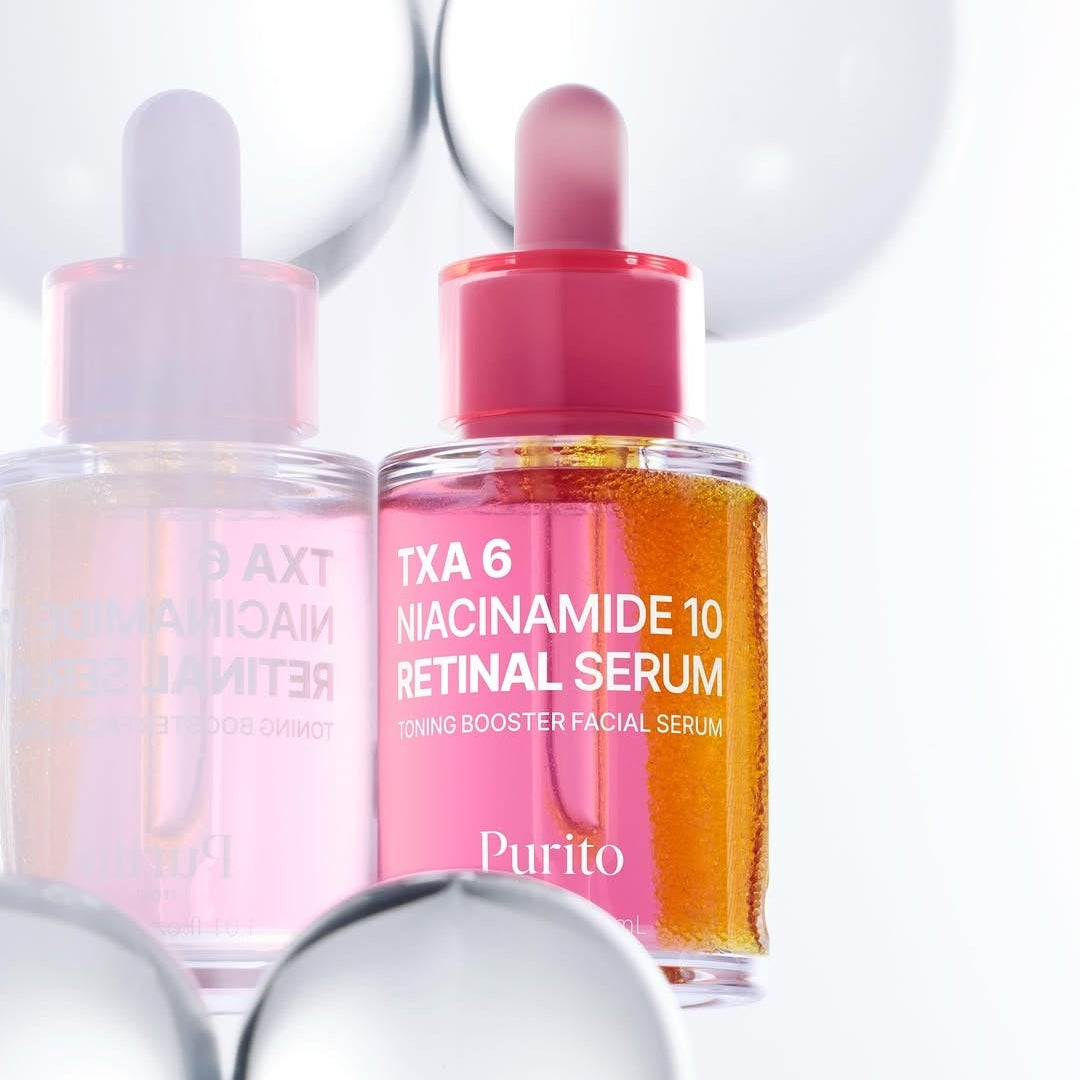 PURITO Tranexamic Acid 6 Niacinamide 10 Retinal Serum 30ml bottle with pink dropper against reflective backdrop.