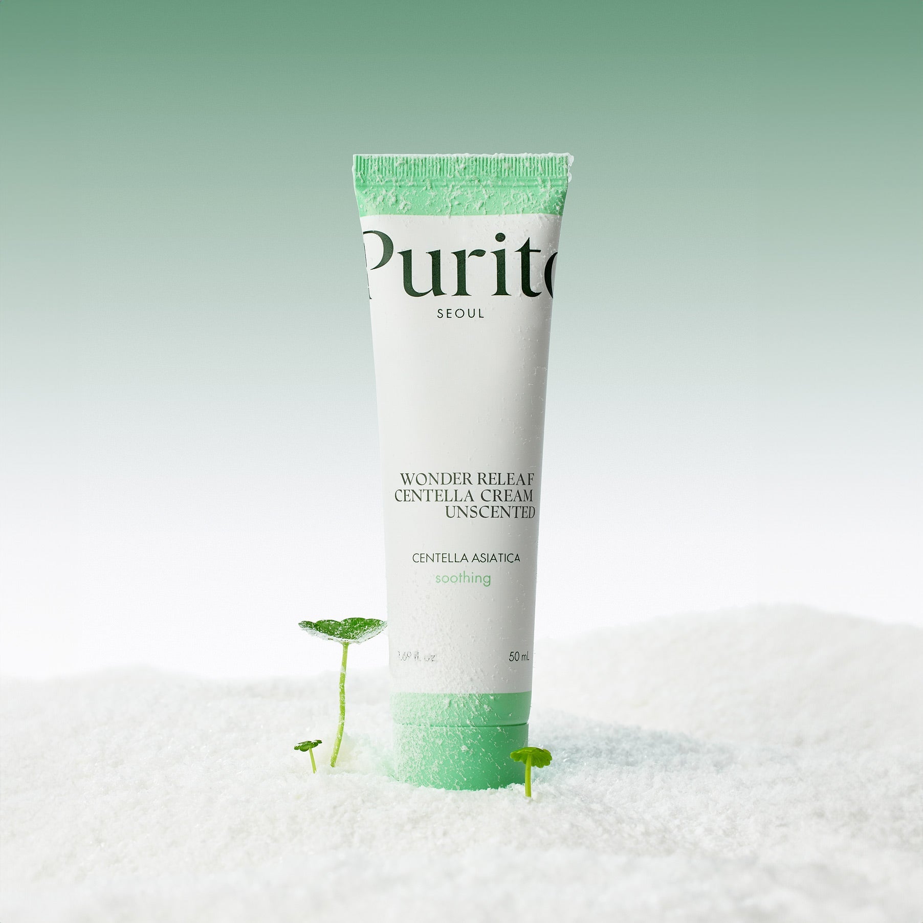 PURITO Wonder Relief Centella Cream Unscented 50ml tube on a textured surface with green accents