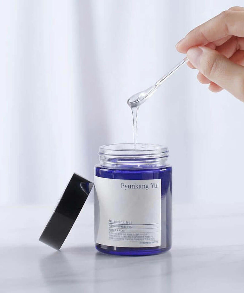 PYUNKANG YUL Balancing Gel 100ml being dispensed from a jar with a spoon