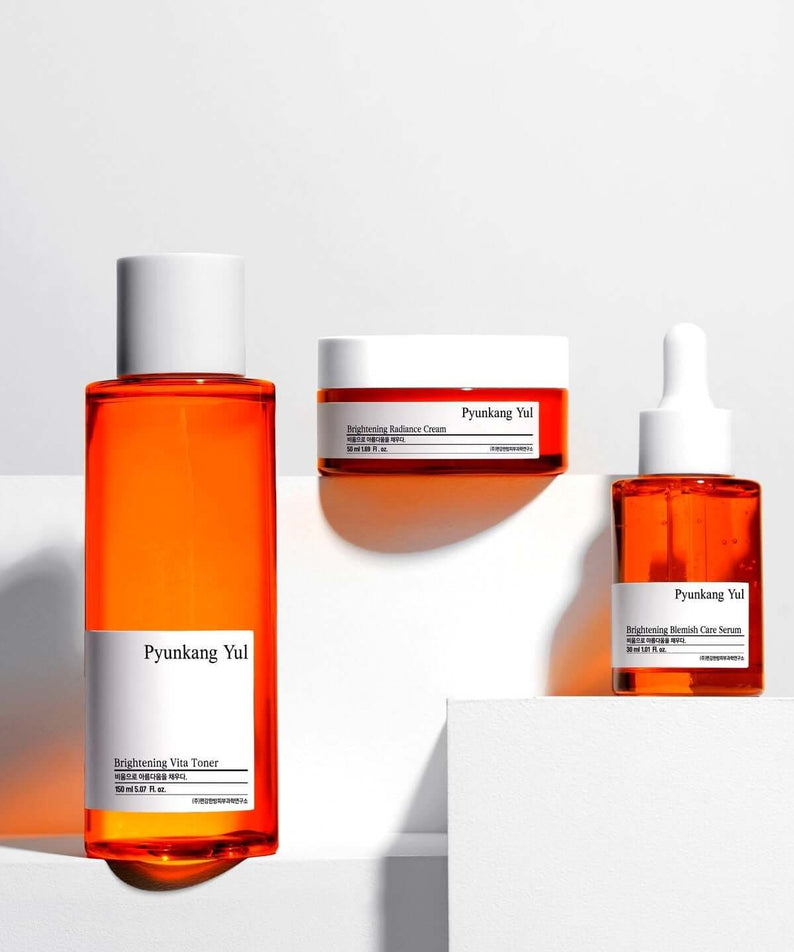 PYUNKANG YUL Brightening Bojagi Gift Set display with toner, cream, and serum bottles.
