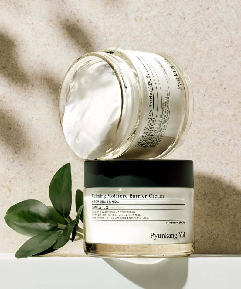 PYUNKANG YUL Calming Moisture Nourishing Cream 50ml jar on display with natural leaves