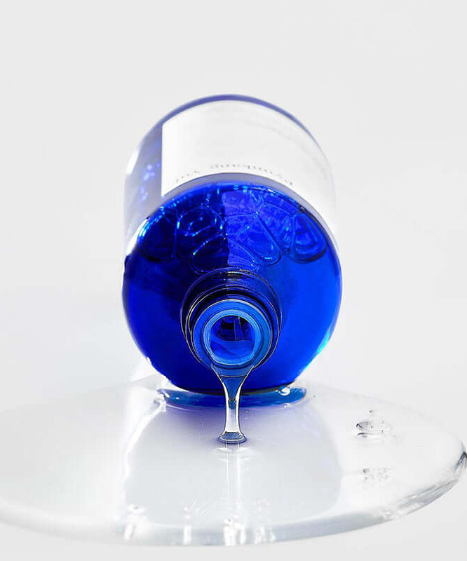 PYUNKANG YUL Moisture Ampoule 100ml bottle with liquid pouring out.