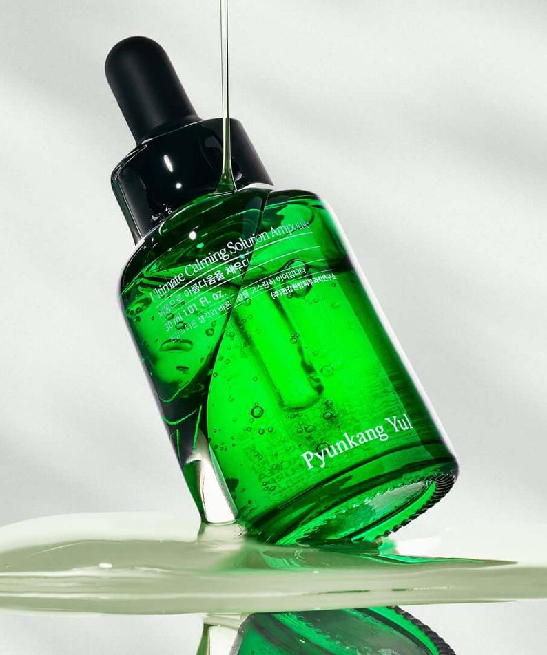 PYUNKANG YUL Ultimate Soothing Solution Ampoule 30ml in vibrant green bottle with dropper, skin care product.