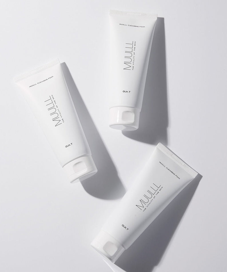 Three tubes of QUA-T Cleansing foam 150g on a white background.