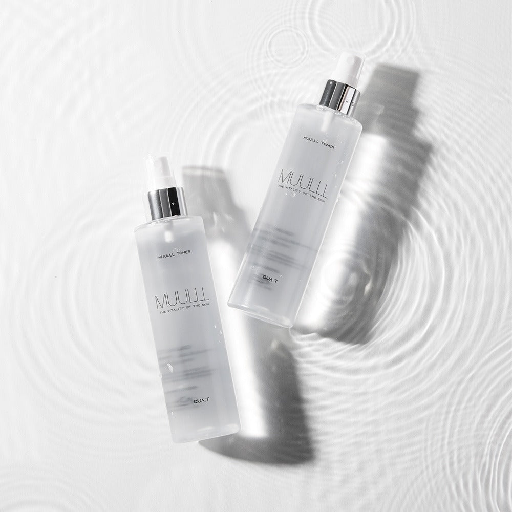 Two bottles on water surface, not related to QUA-T Petavegan Large Capacity Toner 300ml.