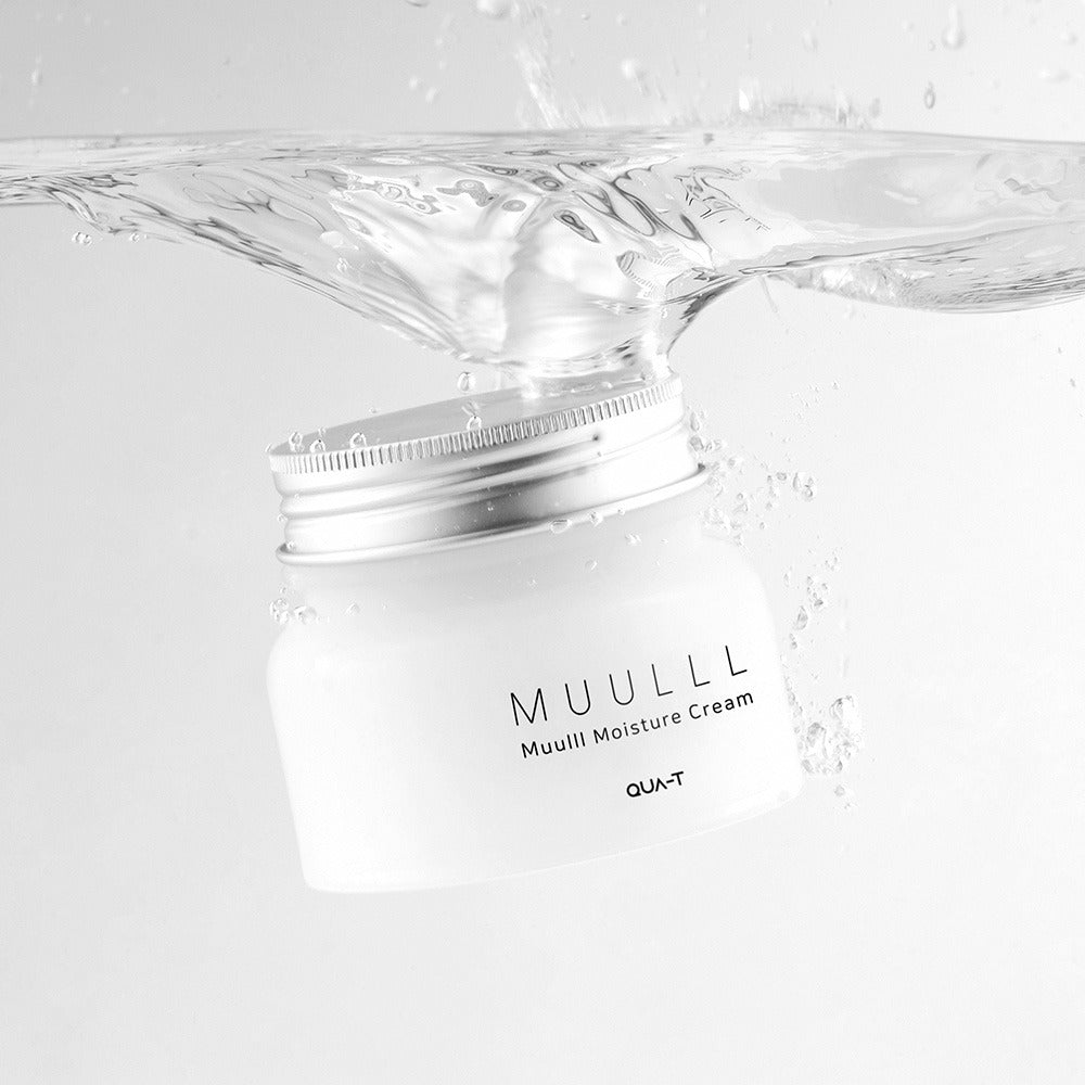 Jar of QUA-T Subuji Moisture Cream 100ml submerged in clear water, showcasing its moisture-enhancing properties.