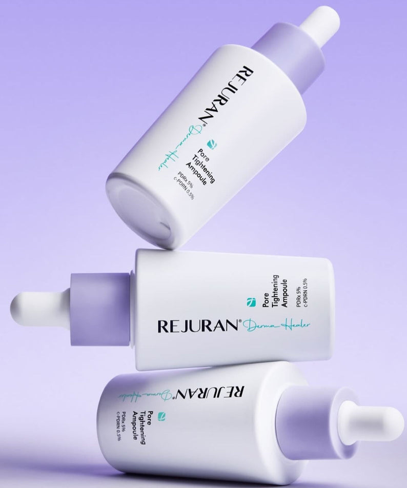 Three bottles of REJURAN Derma Healer Pore Tightening Ampoule 30ml arranged artistically on a purple background.