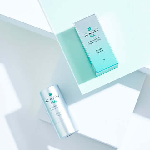 REJURAN Healer UV Protection Balm 19g with packaging displayed on a light surface.