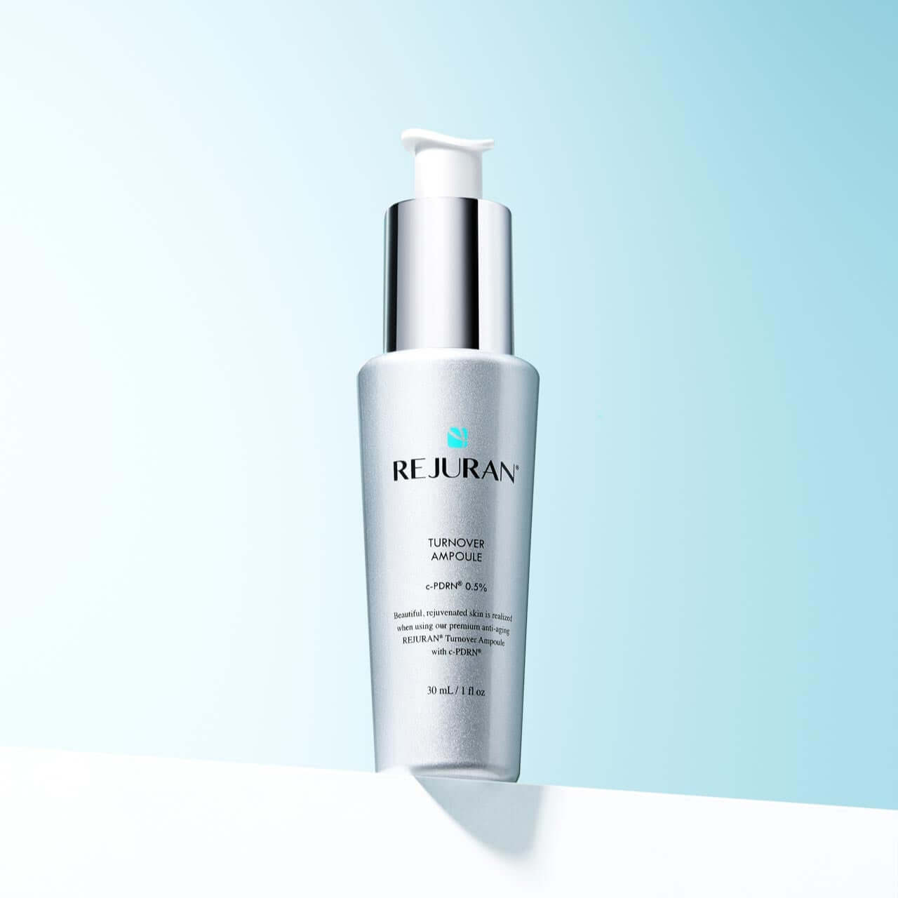 REJURAN Turnover Ampoule 30ml bottle on light blue background.