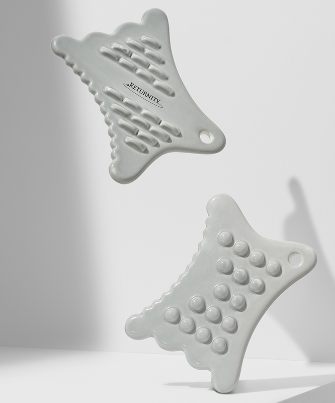 RETURNITY Guasha tools in minimalist design, perfect for facial massage and skincare routines.