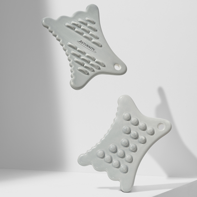 RETURNITY Guasha tools in minimalist design, perfect for facial massage and skincare routines.